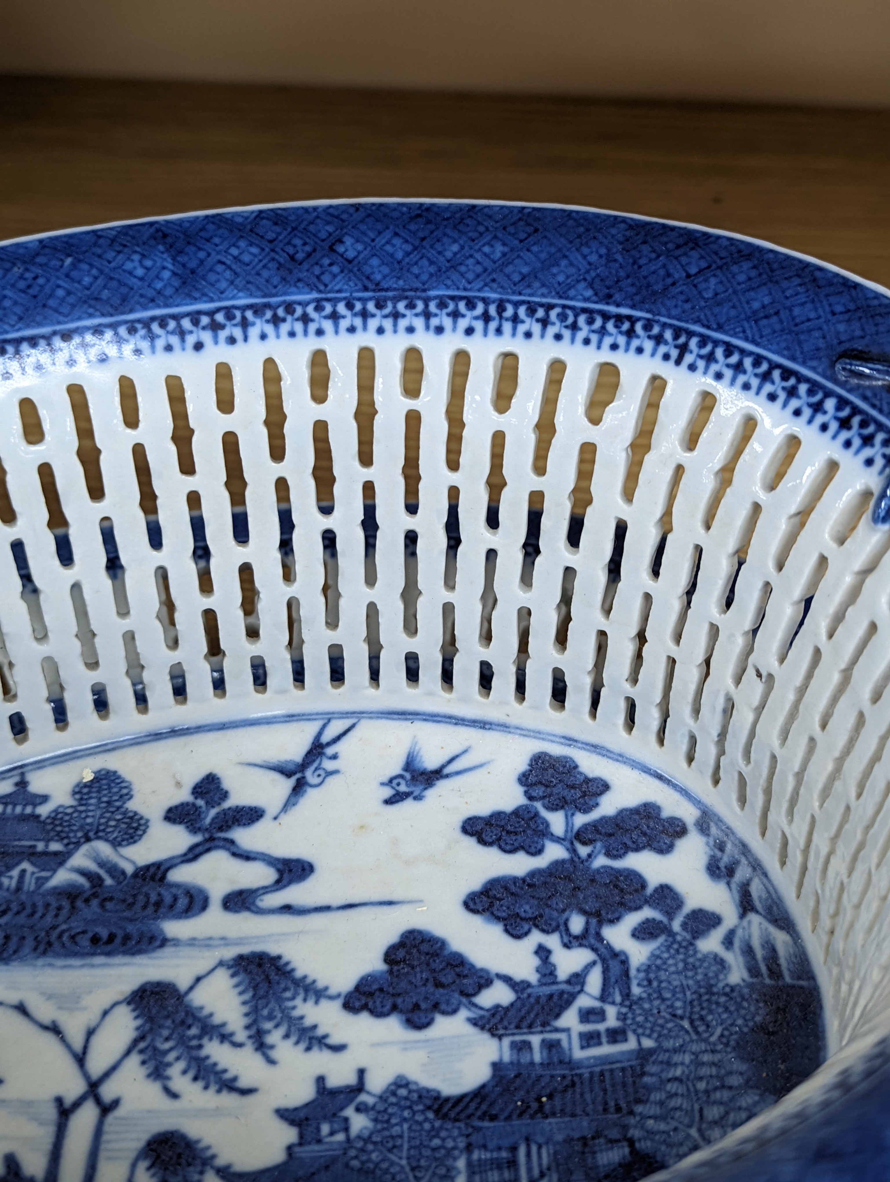 A Chinese blue and white chestnut basket and stand, Qianlong period, basket 11 cms high.